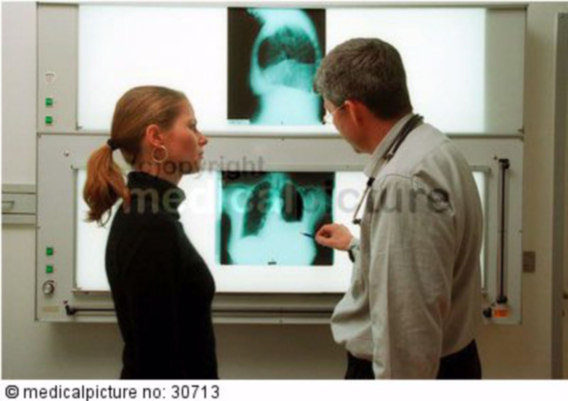 Doctor explaining X-ray image