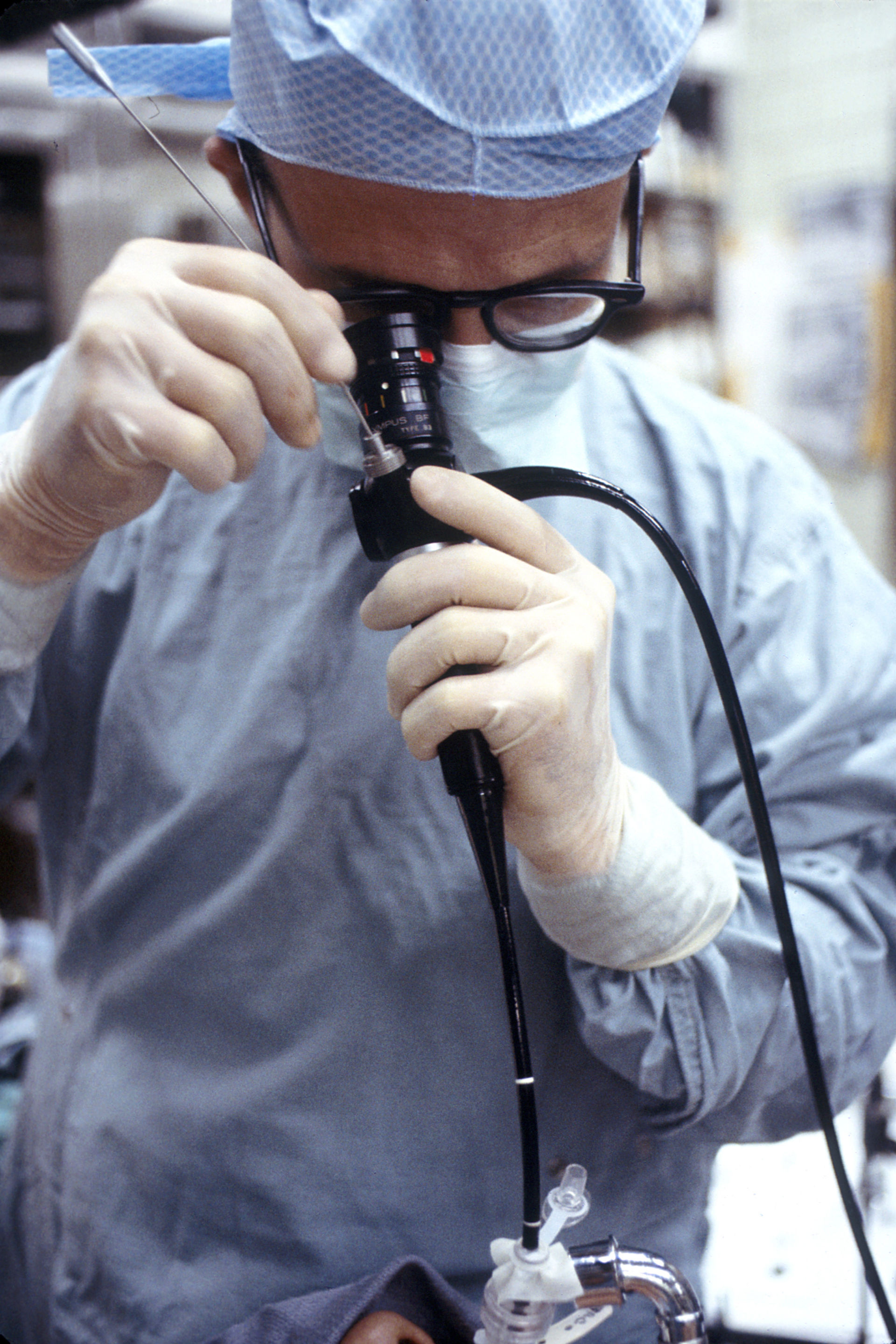 Physician using endoscope (bronchoscope)